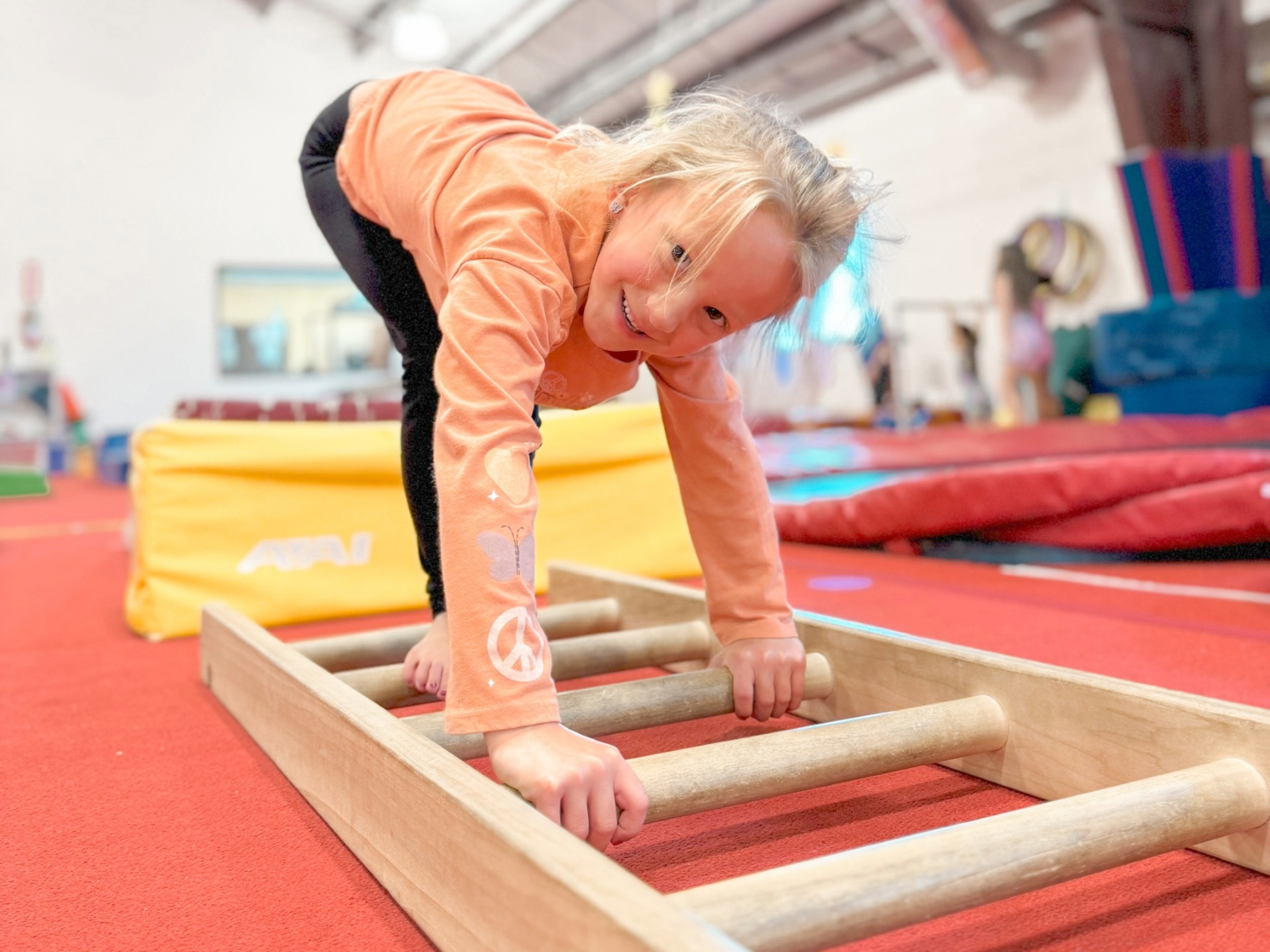 Coach with tumbling students